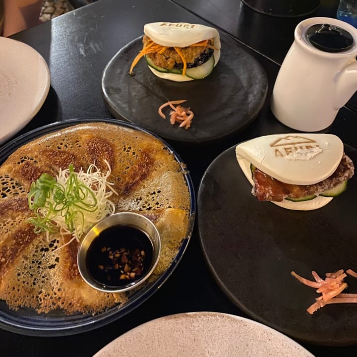 Pork and aubergine bao buns served with miso cashew dumplings, fried to a golden base