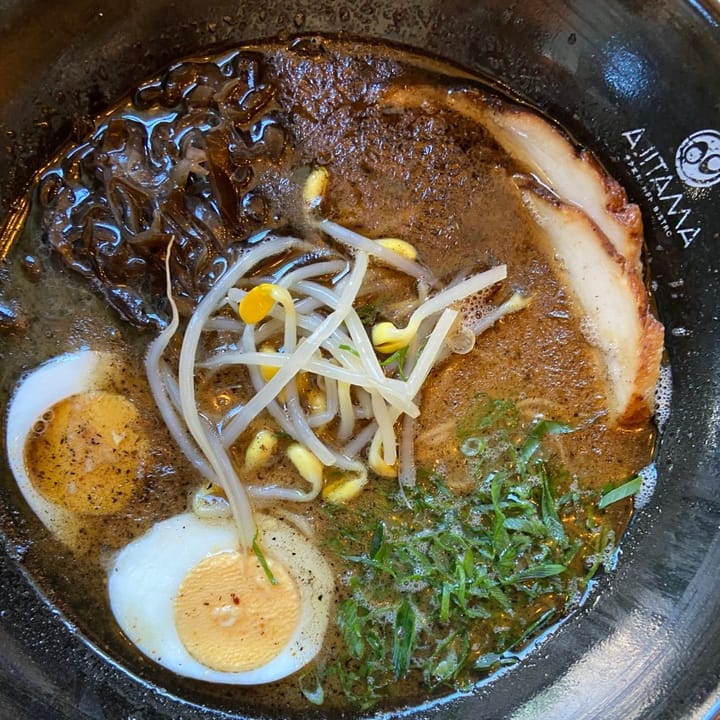 A deliciosus warming bowl of black garlic tonkatsu ramen with pork belly
